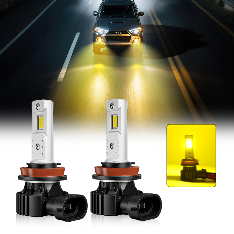 Yellow LED fog light bulbs from 9005 H11 set installed on Toyota 4Runner, enhancing night visibility on road.