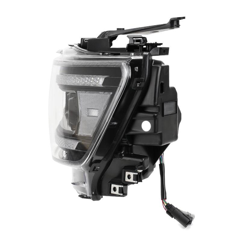Side view of RAM 1500 LED headlight with clear lens and black housing