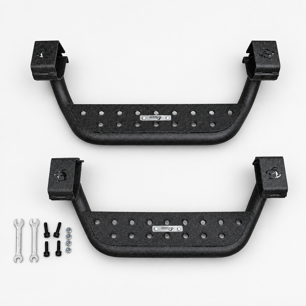 Two black side-step assemblies with four bolts, four nuts and two wrenches on a light background.