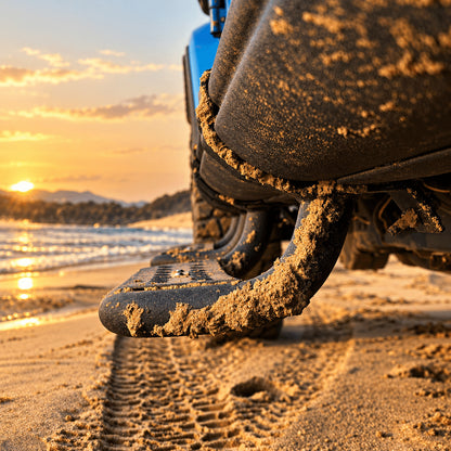 Low side view of a black step extending below the rock rail of a Jeep Gladiator JT on sand.