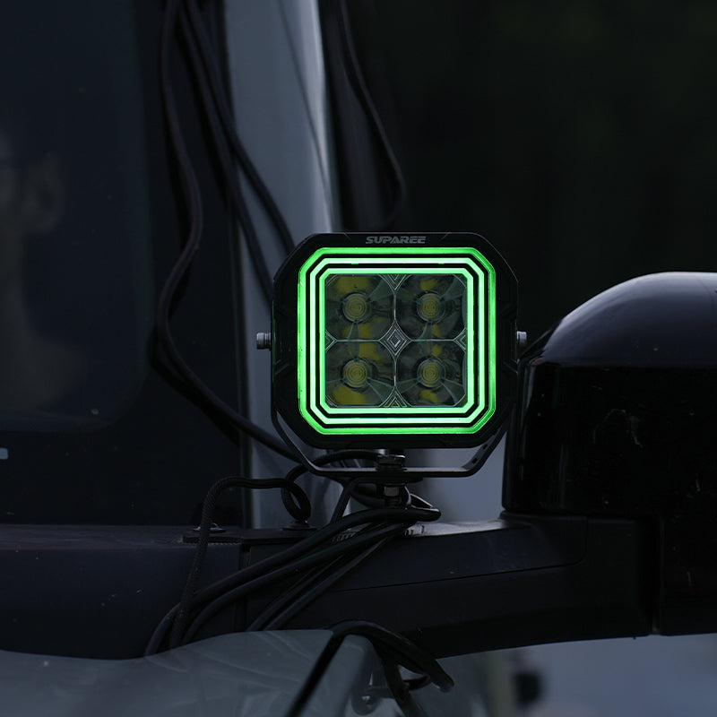SUPAREE HYPER 5 LED pod light with green backlighting installed beside the windshield.