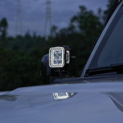 SUPAREE HYPER 5 LED pod light with white backlighting installed beside the windshield.