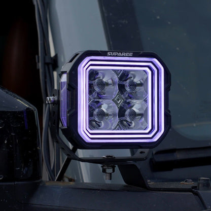Close-up of a SUPAREE HYPER 5 RGBW LED pod light with purple three-layer backlighting.