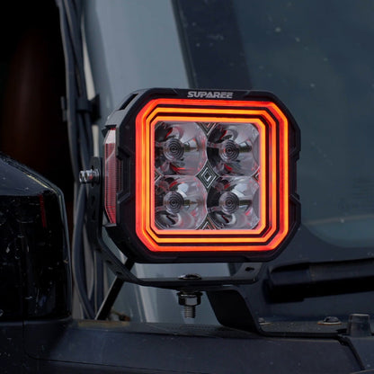 Close-up of a SUPAREE HYPER 5 RGBW LED pod light with red three-layer backlighting.