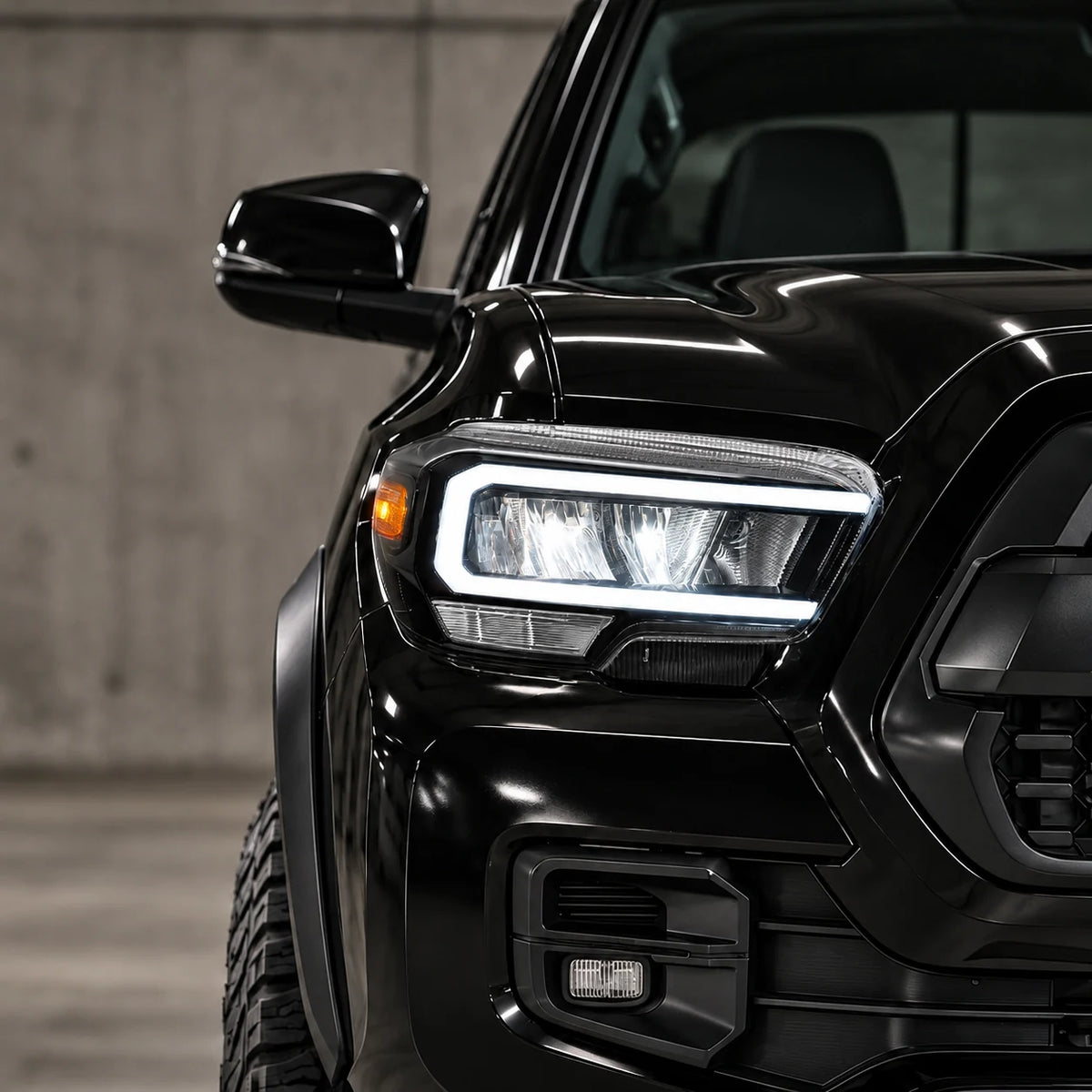 Toyota Tacoma LED low beam illuminated inside the white daytime running light.