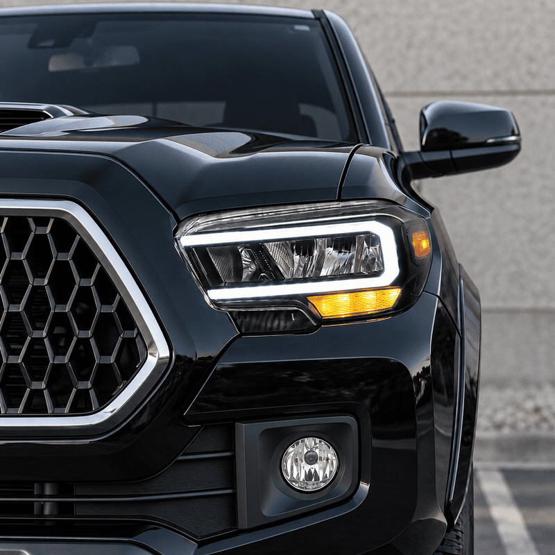 Animated Toyota Tacoma amber LED turn signal blinking while the white DRL stays on.