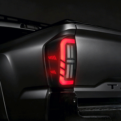 Animated amber sequential turn signal on a smoked LED tail light for 2016-2023 Toyota Tacoma.
