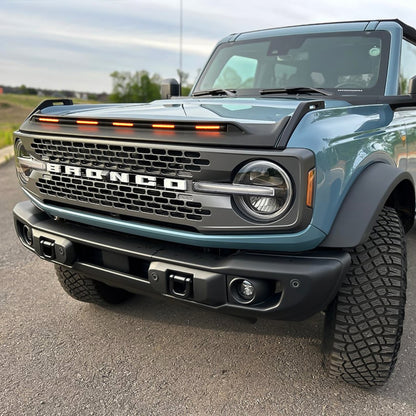 Bronco LightShield hood protector with amber LED lights featured on Ford Bronco customer vehicles in multiple outdoor scenes
