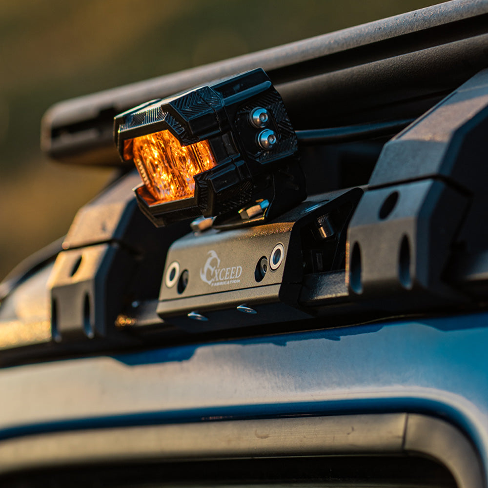 Jeep-Gladiator-JT-driving-on-off-road-trails-with-secure-rain-gutter-ditch-light-mounts