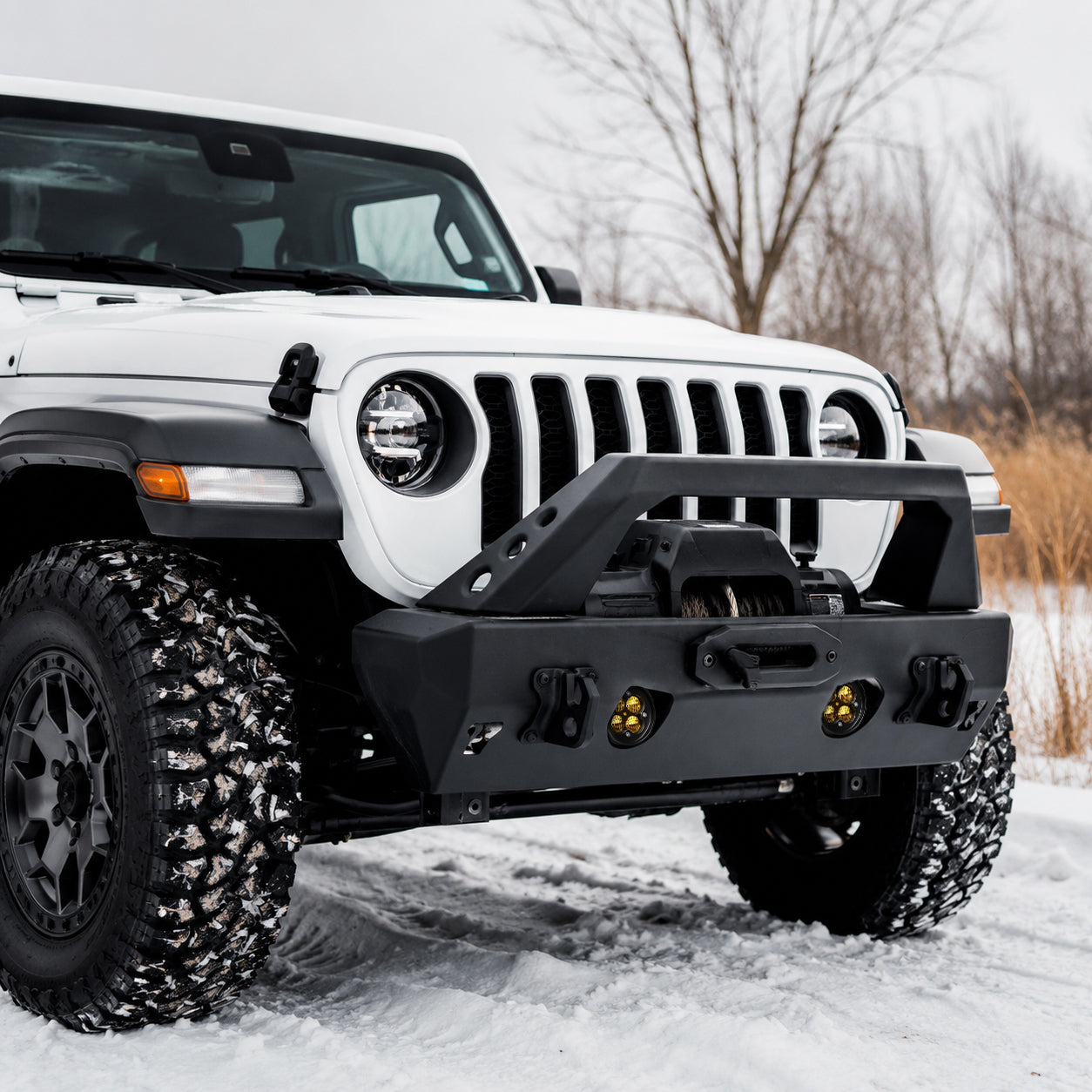 Jeep Wrangler JL amber LED fog lights lighting a snowy off-road trail