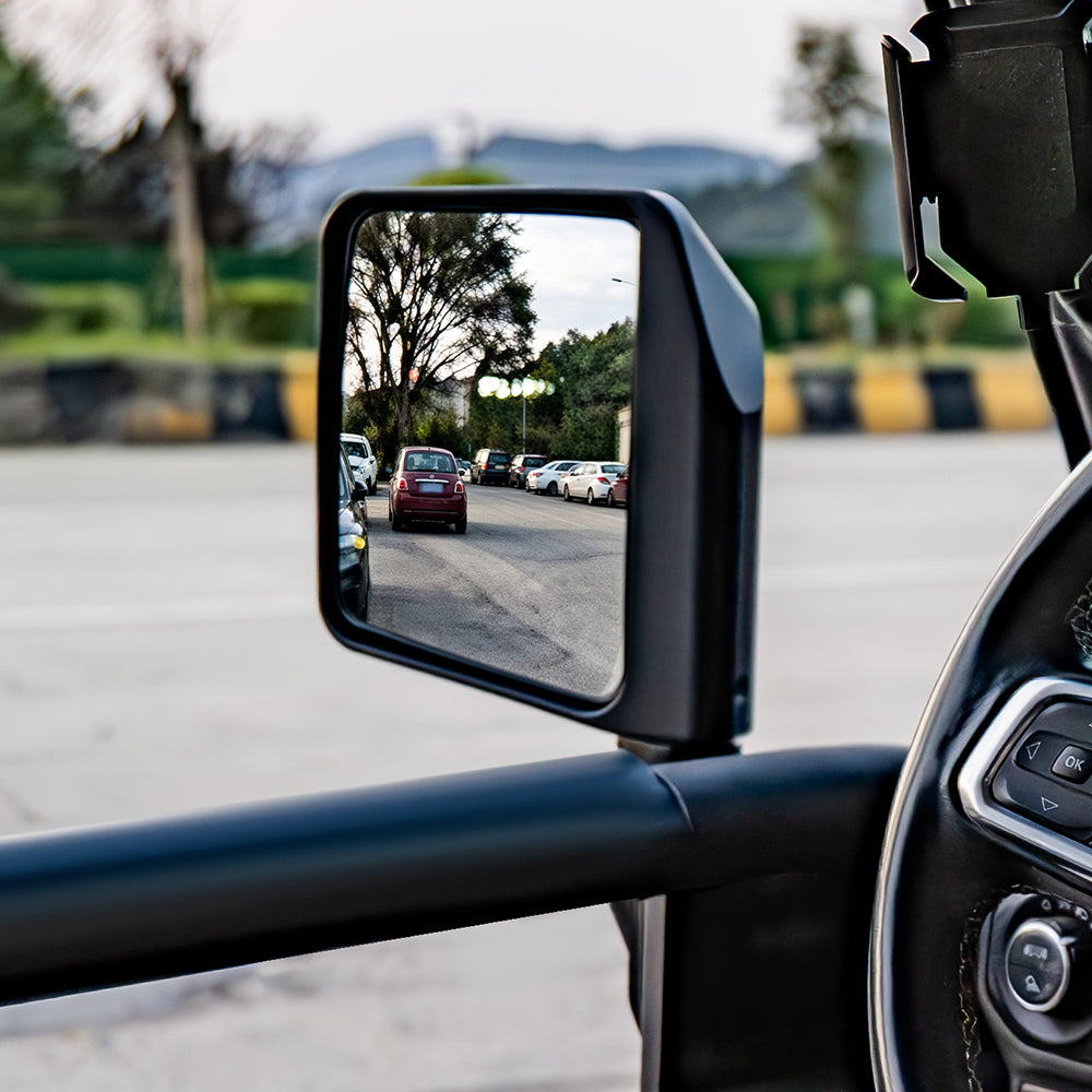 Front-door mirror mounted to an SD1 SERIES tube door from the driver's seat view