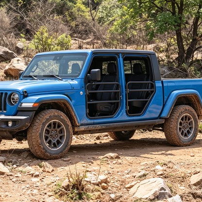 Side view of a blue Jeep Gladiator JT fitted with four SD1 SERIES tube doors on a rocky trail