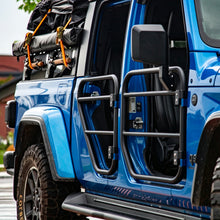 Side view of a blue Jeep Gladiator JT fitted with four SD1 SERIES tube doors on a rocky trail