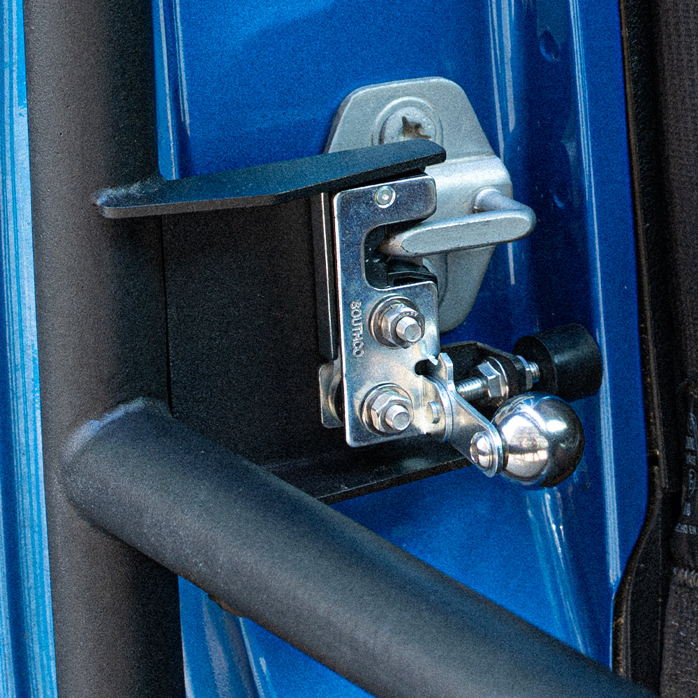 Close-up of the SD1 SERIES tube door latch, secondary catch and rubber contact buffer