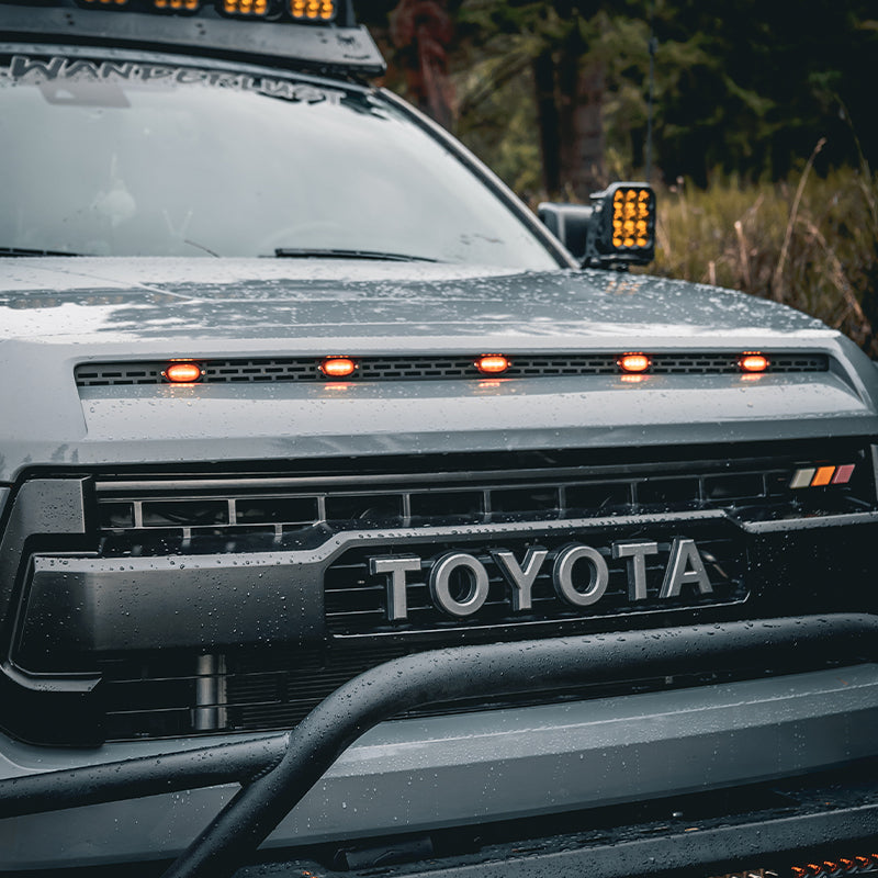 Enhance tundra's exterior with this beautiful hood scoop trim, featuring five small lights.