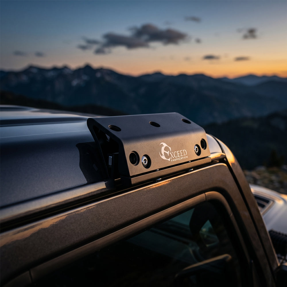 Close-up-of-clamp-on-rain-gutter-light-mount-attached-to-Jeep-JL-freedom-top-without-drilling