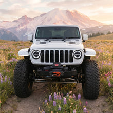 jeep-wrangler-custom-led-headlights-with-glowing-rgb-halo-ring-and-four-visible-projector-lenses-in-a-dark-garage