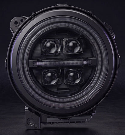 jeep-wrangler-custom-led-headlights-with-glowing-rgb-halo-ring-and-four-visible-projector-lenses-in-a-dark-garage