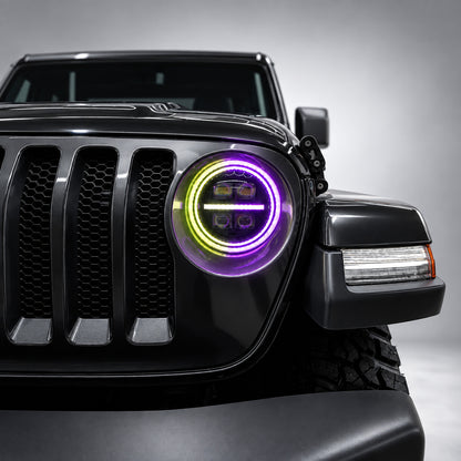 Close-up of a 9-inch Jeep RGB LED headlight with purple and yellow-green dual halo lighting