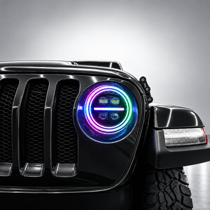 Close-up of a 9-inch Jeep RGB LED headlight with rainbow spectrum dual halo rings