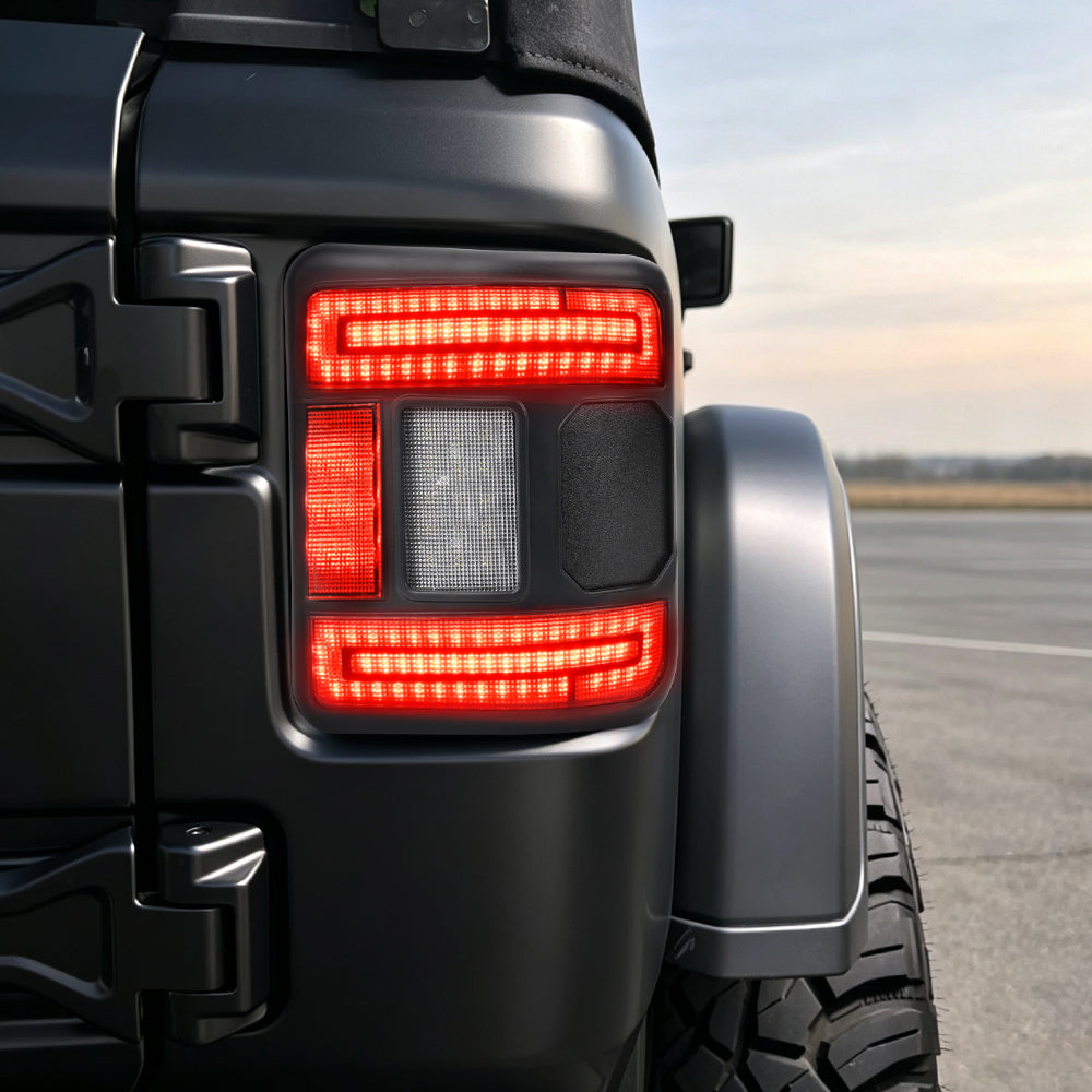 Installed smoked CR072 tail light illuminated with its red running-light signature on a Jeep Wrangler JL.