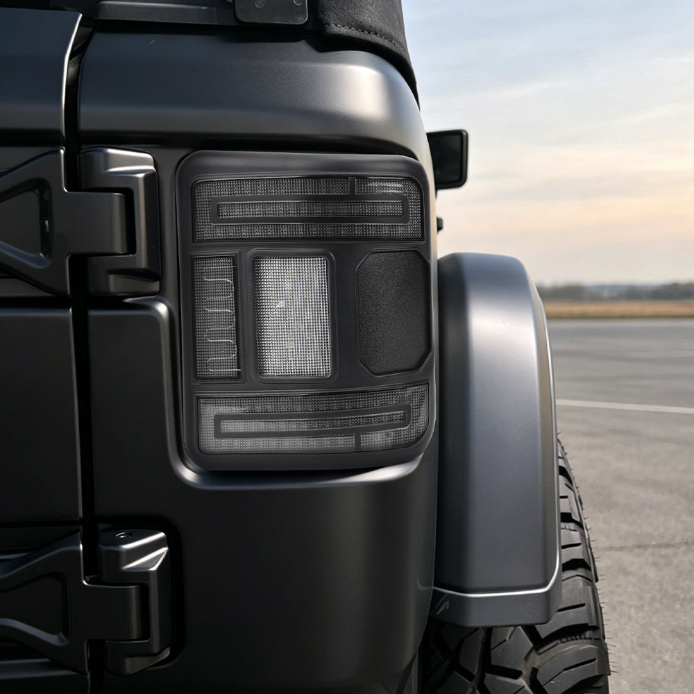 Unlit smoked CR072 flush-mount tail light sitting close to the rear body of a Jeep Wrangler JL.