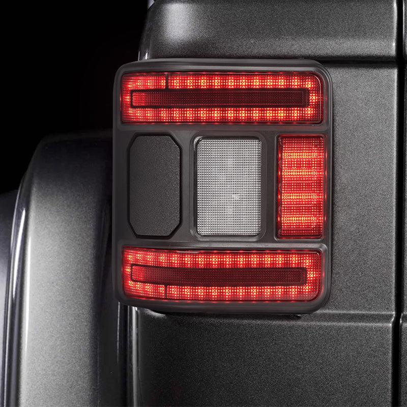 Close-up poster of the smoked Jeep Wrangler JL LED tail light during its startup welcome sequence.