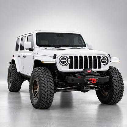 White four-door Jeep Wrangler JLU with 9-inch LED headlights and white DRL rings, front three-quarter view