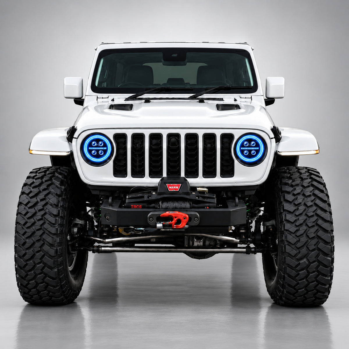 White Jeep Wrangler JL front view with blue RGB LED headlight halo rings