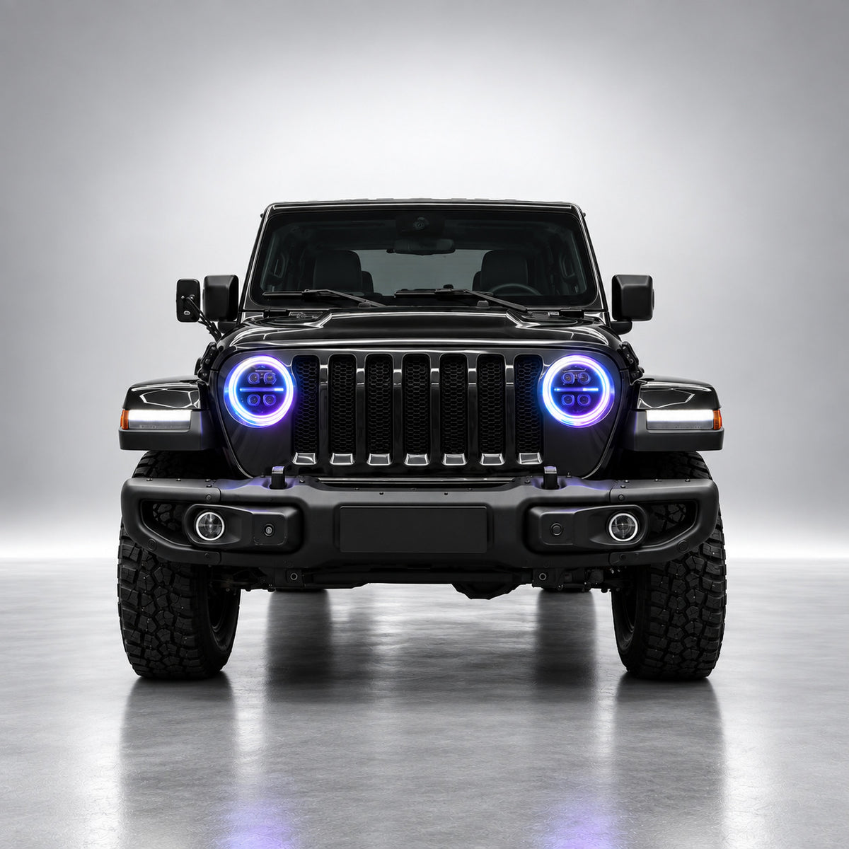 Black Jeep Wrangler JL front view with blue and violet RGB LED headlight rings