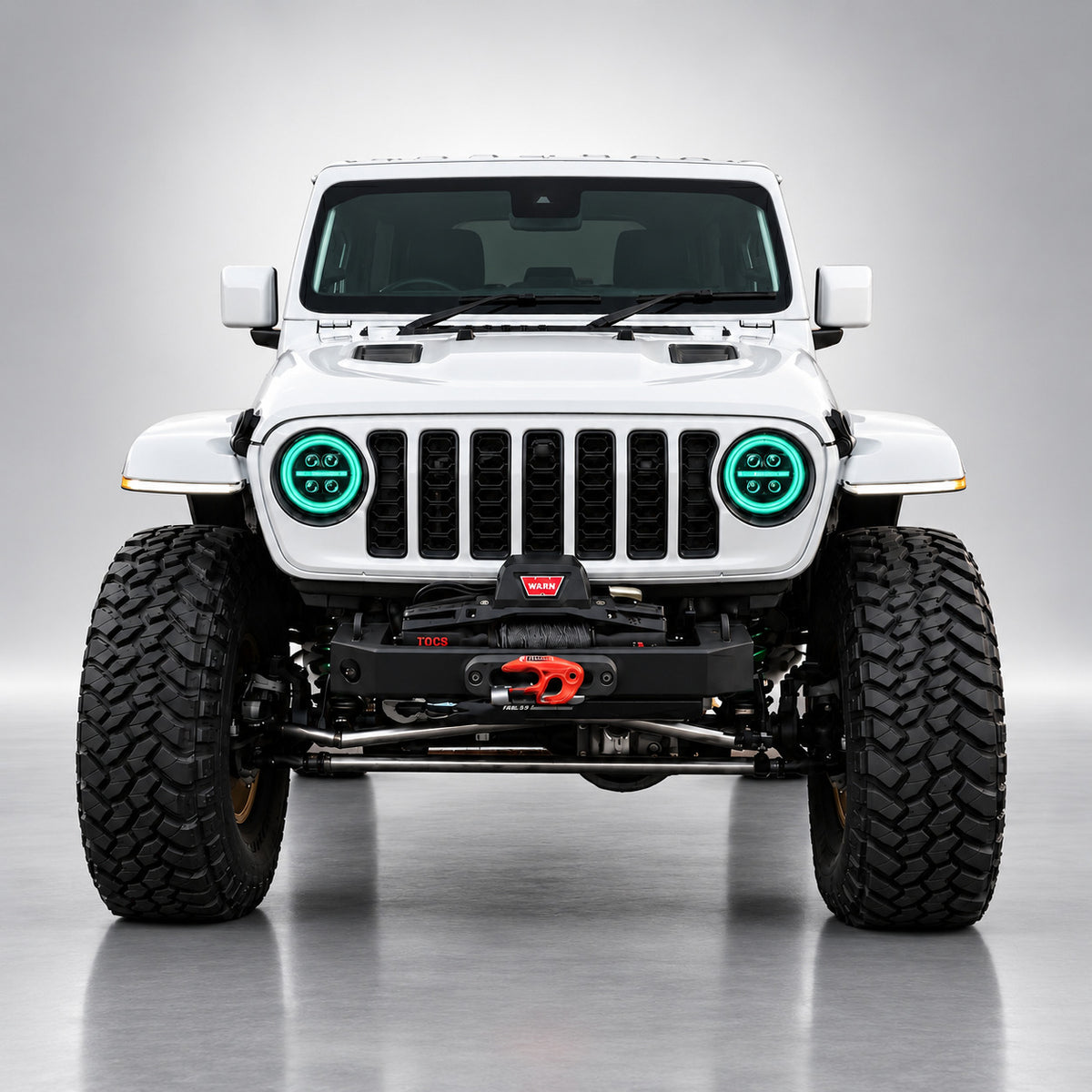 White Jeep Wrangler JL front view with cyan RGB LED headlight halo rings