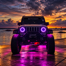 Modified Jeep Wrangler JL at sunset with purple RGB LED headlight halos, centered front view