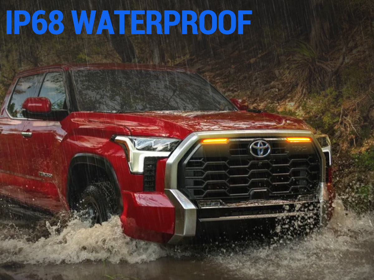 Toyota Tundra with grille lights driving through rain